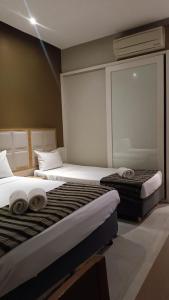 Hotel Atlântico Tower客房内的一张或多张床位