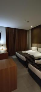 Hotel Atlântico Tower客房内的一张或多张床位