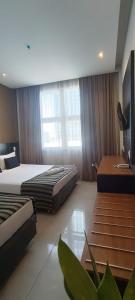 Hotel Atlântico Tower客房内的一张或多张床位