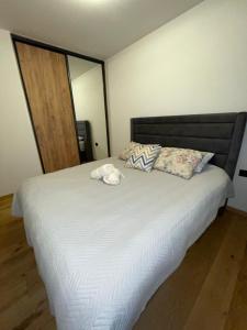 Ένα ή περισσότερα κρεβάτια σε δωμάτιο στο Apartman Yellow Bjelasnica +3 φωτογραφίες