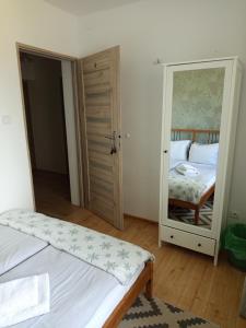 Łóżko lub łóżka w pokoju w obiekcie Husarska Swinemünde