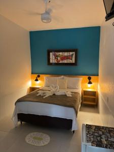 Cama ou camas em um quarto em Pousada Tropical Araçatiba