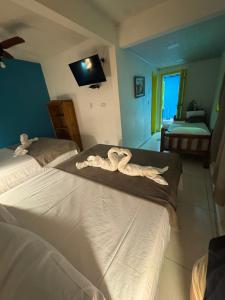 Cama ou camas em um quarto em Pousada Tropical Araçatiba