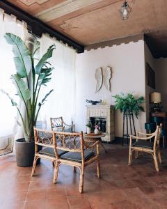 a living room with two chairs and a fireplace at Palazzo Isabella residenza storica in Borgo San Giacomo in Borgo San Giacomo