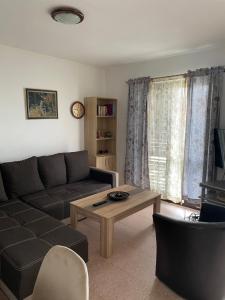 a living room with a couch and a coffee table at Bigova Peace Oasis in Bigovo