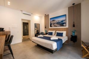 Ένα ή περισσότερα κρεβάτια σε δωμάτιο στο Al Capo Suite Home