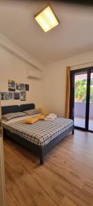 Кровать или кровати в номере Eraclea Minoa Apartments