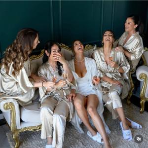 a group of women sitting on a couch with wine glasses at Vila Safra in Vrnjačka Banja +86 photos