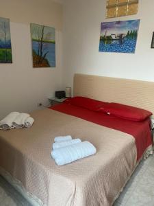 Posteľ alebo postele v izbe v ubytovaní Casa vacanza La Ninfea intera casa