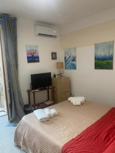 Posteľ alebo postele v izbe v ubytovaní Casa vacanza La Ninfea intera casa