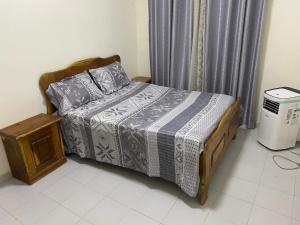 Katil atau katil-katil dalam bilik di Teranga Lodge Diamniadio
