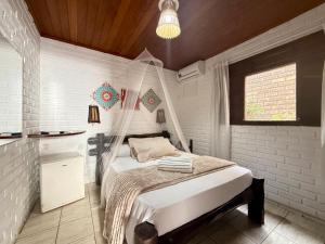 Ένα ή περισσότερα κρεβάτια σε δωμάτιο στο Oceana Suites Villas de Tibau +62 φωτογραφίες