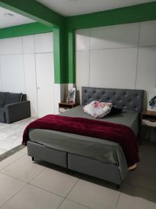 Ένα ή περισσότερα κρεβάτια σε δωμάτιο στο Loft no centro perto de tudo