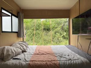 Katil atau katil-katil dalam bilik di Tiny House en Santiago NL