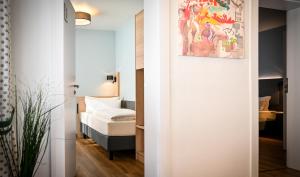 A bed or beds in a room at Hotel Mainblick Garni