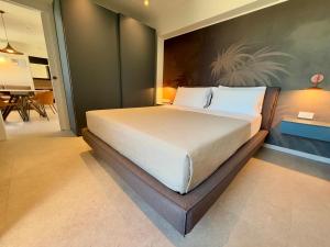 a bedroom with a large bed in a room at Suite Apartments Prestige in Bellaria-Igea Marina