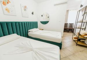 Krevet ili kreveti u jedinici u okviru objekta Hotel Floga