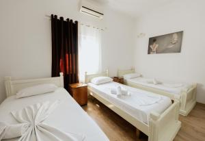 Krevet ili kreveti u jedinici u okviru objekta Hotel Floga