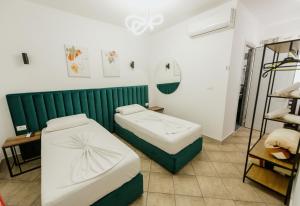 Krevet ili kreveti u jedinici u okviru objekta Hotel Floga