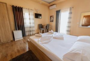 Krevet ili kreveti u jedinici u okviru objekta Hotel Floga