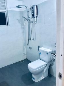 a bathroom with a toilet and a shower at Millennium Elite in Opata +44 photos