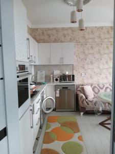 a kitchen with a rug on the floor at Baku Confor Home in Baku
