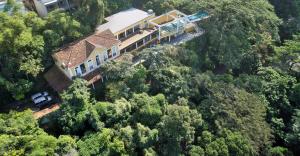 an aerial view of a house in the forest at Casa Altos de Santa Teresa in Rio de Janeiro