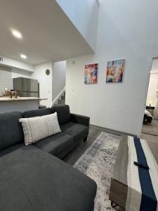 a living room with a couch and a table at 2BD STATE FAIR l DT Dallas l FIFA READY l 5 Min from Love Field in Dallas +16 photos