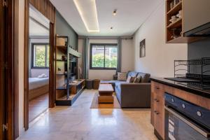 a living room with a couch and a table at Résidence Cerezo in Maarif