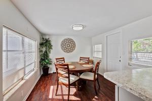 a dining room with a table and chairs at Charming West Palm Beach Home in West Palm Beach