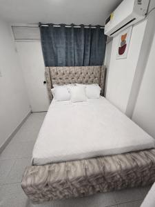 Ένα ή περισσότερα κρεβάτια σε δωμάτιο στο Apartamento SONGO 8 +9 φωτογραφίες