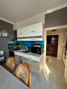 a kitchen with a sink and a counter top at Golden Sun in Pomorie