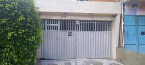 a metal garage door in front of a building at Casatelégrafo in Belém