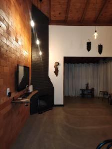 Et tv og/eller underholdning på Chalé Vista pra Lombada