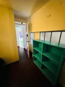 a room with a green counter and a door at AQUI ME QUEDO here I Stay in Bogotá +54 photos