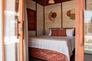 Giường trong phòng chung tại Vila Ammos Beach Houses