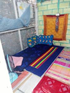 a room with a bunch of ties on the floor at The Rock Hut in Ko Lanta