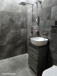 a bathroom with a sink and a toilet at BELLA VISTA Homestay BNB in Zirakpur +29 photos