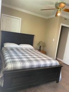 a bedroom with a bed and a ceiling fan at Studio Full kitchen private gated yard Arts Roosevelt row ASU convention ctr Downtown Phx in Phoenix