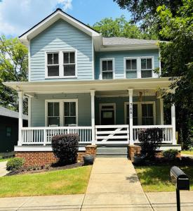 a blue house with a white porch at Bright & Spacious 5 min downtown in Atlanta