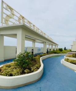 a view of a hospital with a building at RQ Stays! at Milan Residenze Fairview in Manila