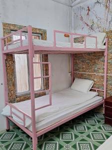 a couple of bunk beds in a room at Sapa Tatu Homestay in Sa Pa