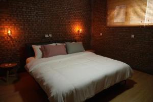 Beijing MutianyuGreat Wall Let'sgo Hotel&Bar客房内的一张或多张床位