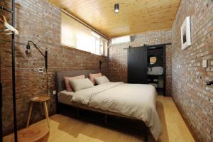 Beijing MutianyuGreat Wall Let'sgo Hotel&Bar客房内的一张或多张床位