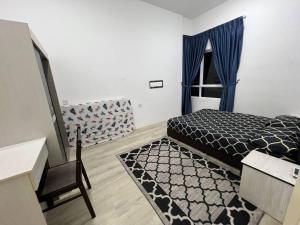 Ένα ή περισσότερα κρεβάτια σε δωμάτιο στο Homestay The Peak Condo