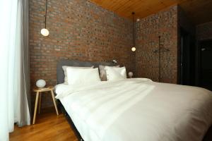Beijing MutianyuGreat Wall Let'sgo Hotel&Bar客房内的一张或多张床位