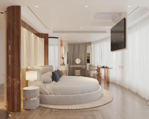 Un dormitorio con una gran cama blanca y un televisor. en Tulip Cruise by HAG, en Ha Long