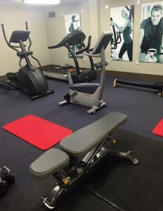 a gym with several exercise bikes in a room at Bishop's Gate Hotel in Derry Londonderry