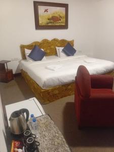 Postel nebo postele na pokoji v ubytování Tea Bush Hotel