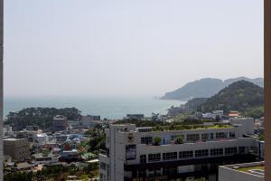 a view of a city with the ocean in the background at The Osiria in Busan